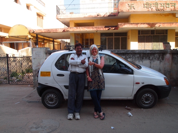 Singh and me and his little car, in which we've spent the last 7 days....