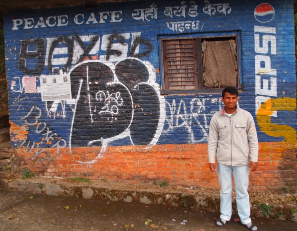 my driver and the now dilapidated Peace Cafe